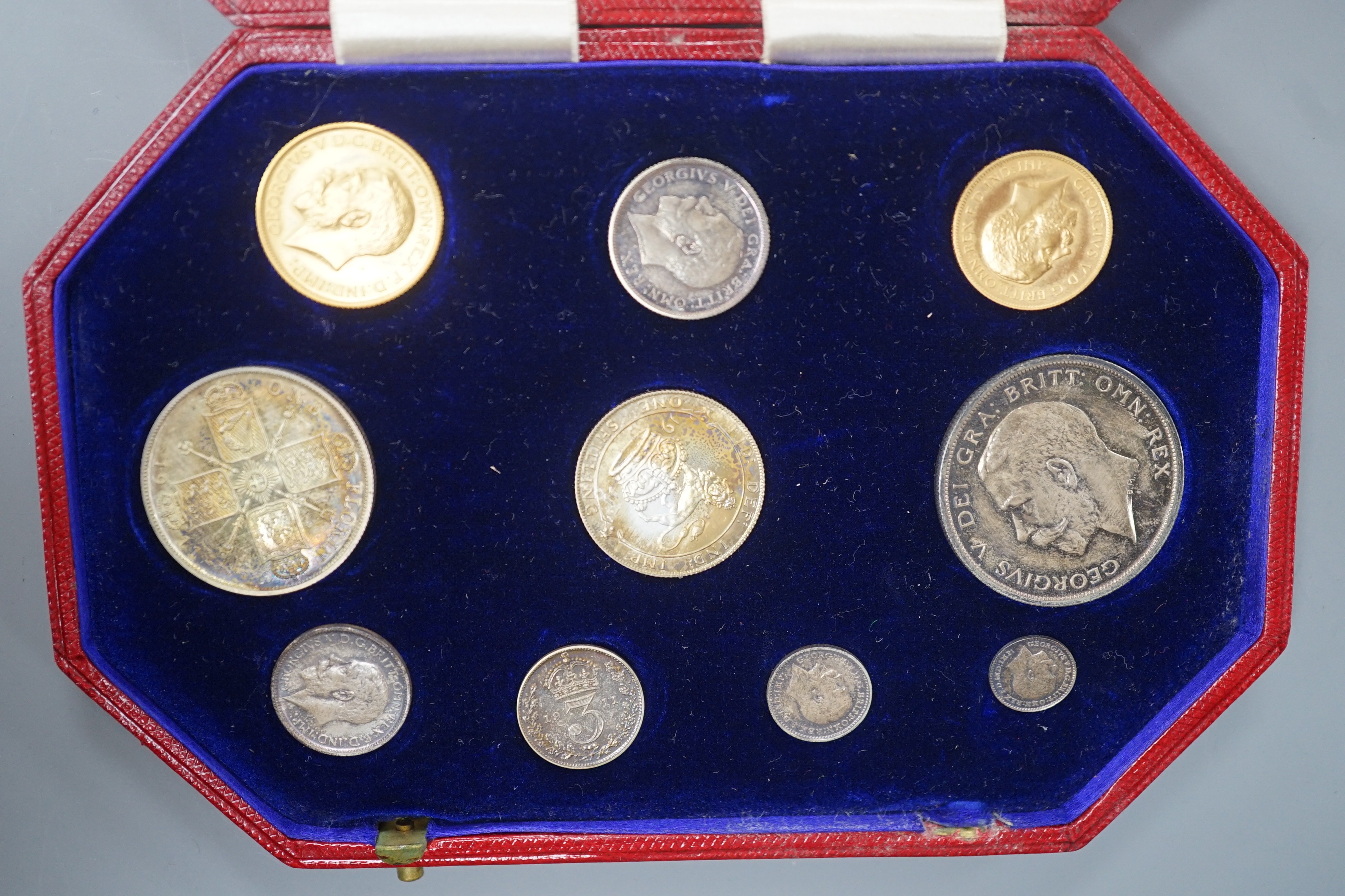 A George V specimen coin set 1911, comprising gold sovereign, and half sovereign, silver half crown, florin, shilling, 6d and Maundy 1d– 4d, UNC with toning to silver coins